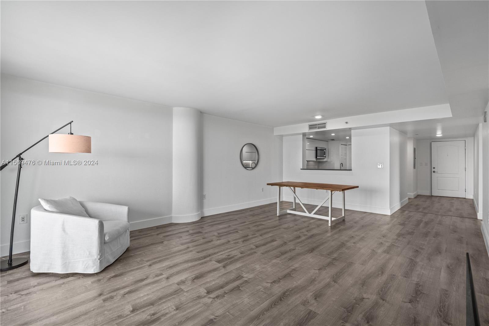 2101 Brickell Avenue, Unit 2012 Miami, FL 33129 - Photo 28 of 44 a living room with furniture and a wooden floor