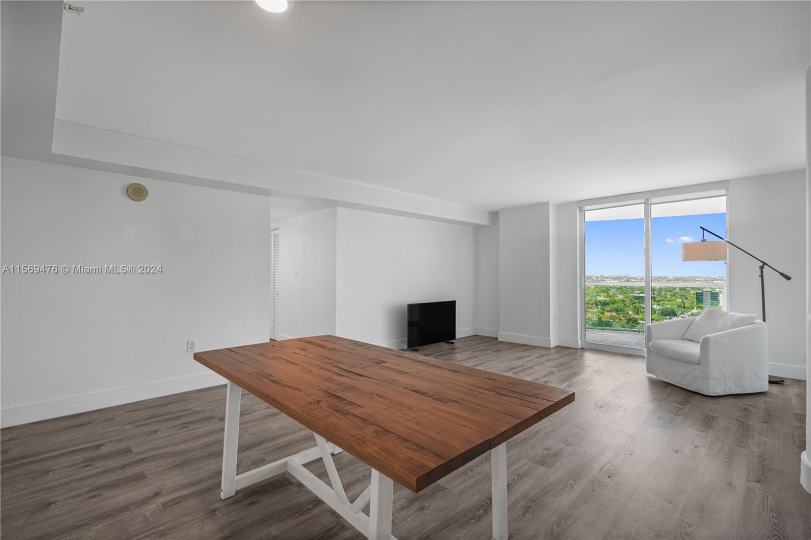 2101 Brickell Avenue, Unit 2012 Miami, FL 33129 - Photo 35 of 44 a living room with furniture and wooden floor