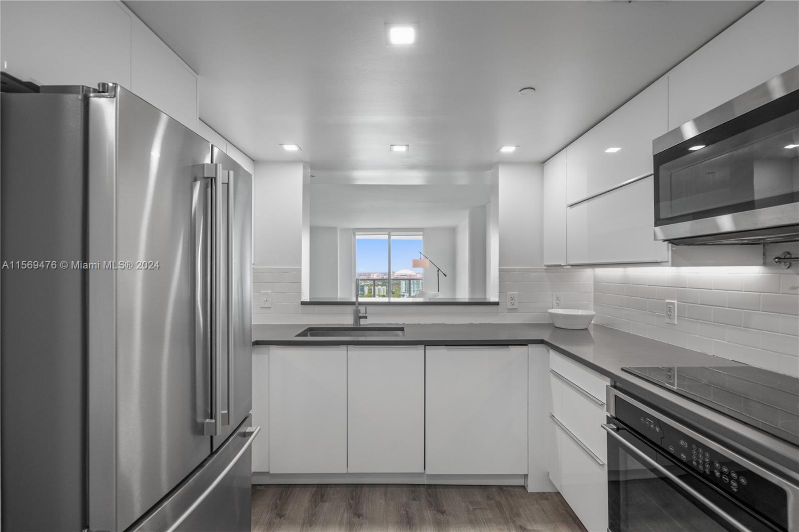 2101 Brickell Avenue, Unit 2012 Miami, FL 33129 - Photo 39 of 44 a kitchen with a sink stainless steel appliances and cabinets