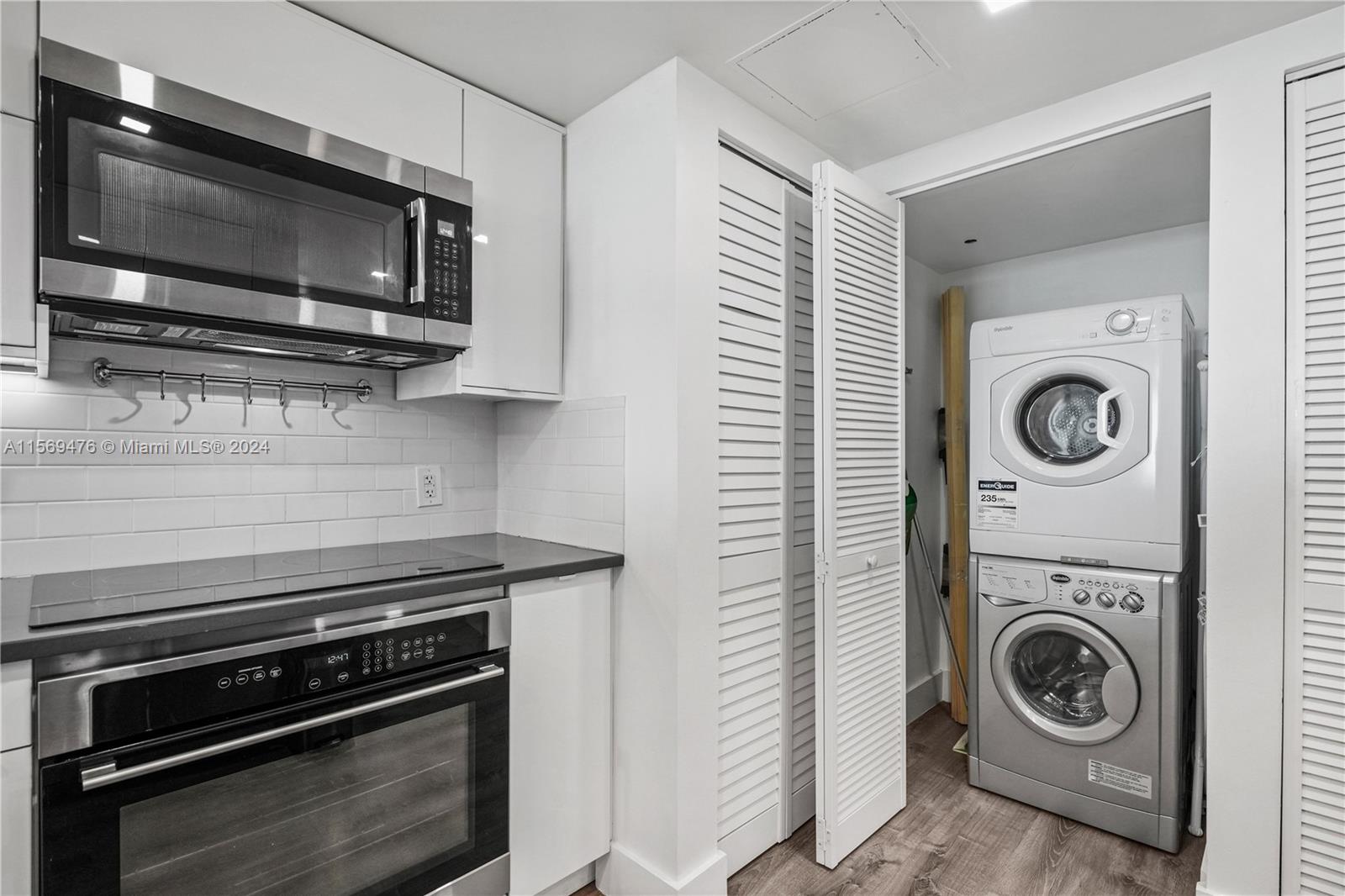 2101 Brickell Avenue, Unit 2012 Miami, FL 33129 - Photo 8 of 44 a kitchen with a stove and a microwave