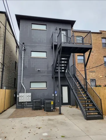 a view of a building with wooden stairs
