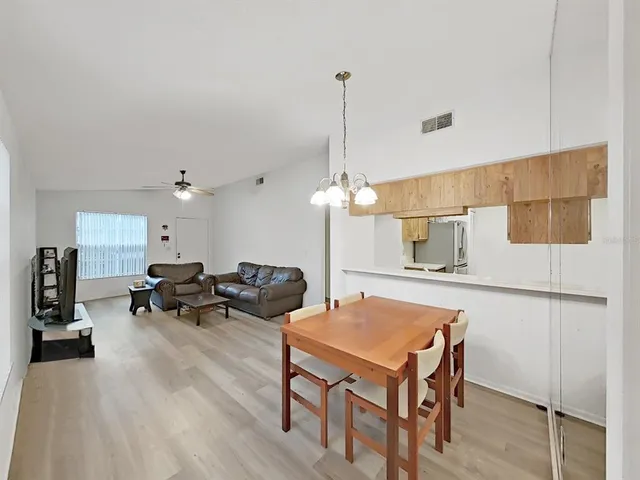 a bedroom with furniture and a book shelf