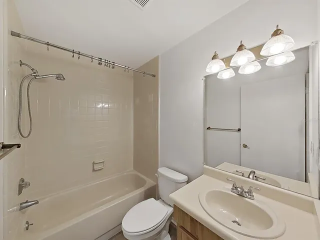 a kitchen that has a sink and a stove in it