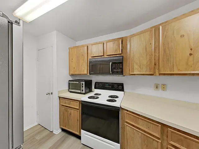 a view of staircase with large trees