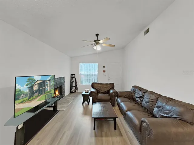 a living room with furniture and a window