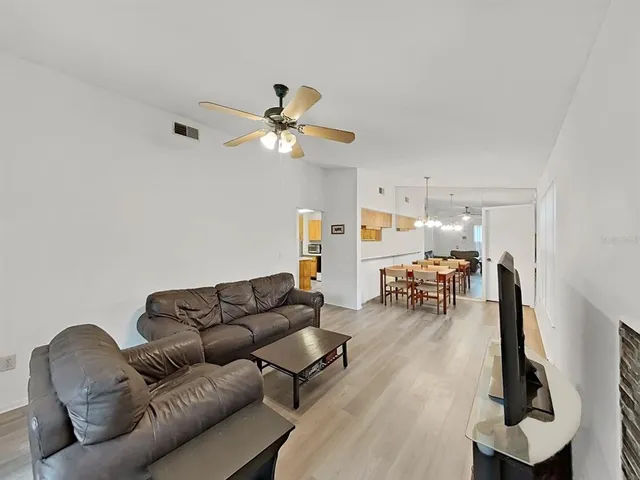 a view of a dining room and a table chairs