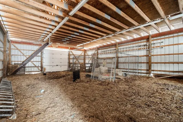 a view of a backyard with table and chairs