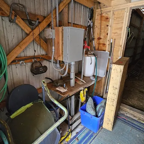 a backyard of a house with table and wooden fence