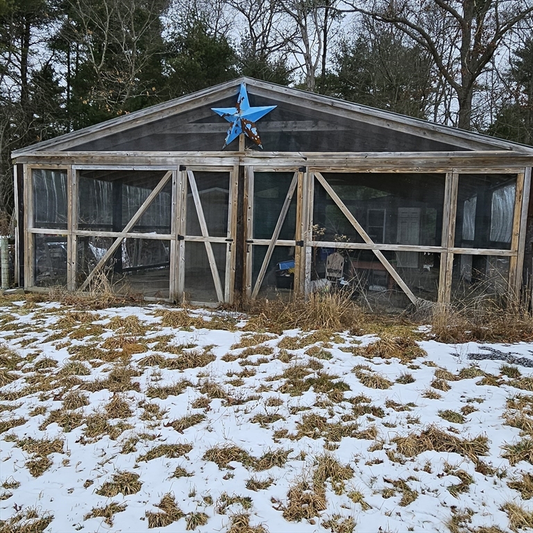 0 Murdock Street Middleboro, MA 02346 - Photo 22 of 30 a backyard of a house with table and wooden fence