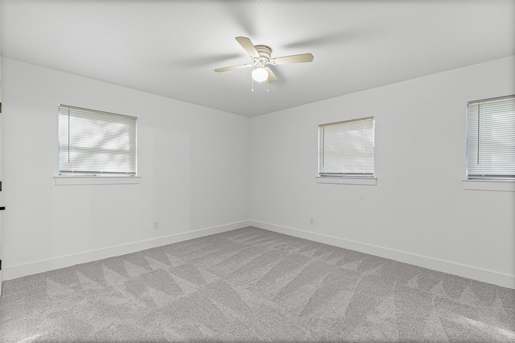 1509 Shirley Way Bedford, TX 76022 - Photo 15 of 26 Spare room featuring light carpet and ceiling fan
