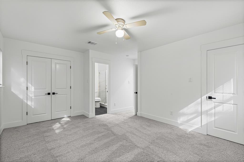 1509 Shirley Way Bedford, TX 76022 - Photo 16 of 26 Unfurnished bedroom with carpet floors, ceiling fan, a closet, and ensuite bath
