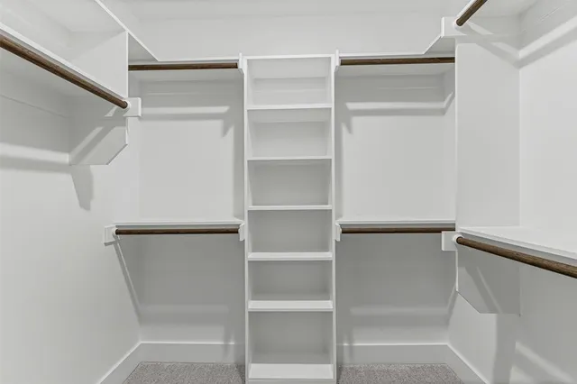 a bathroom with a toilet a sink and shower