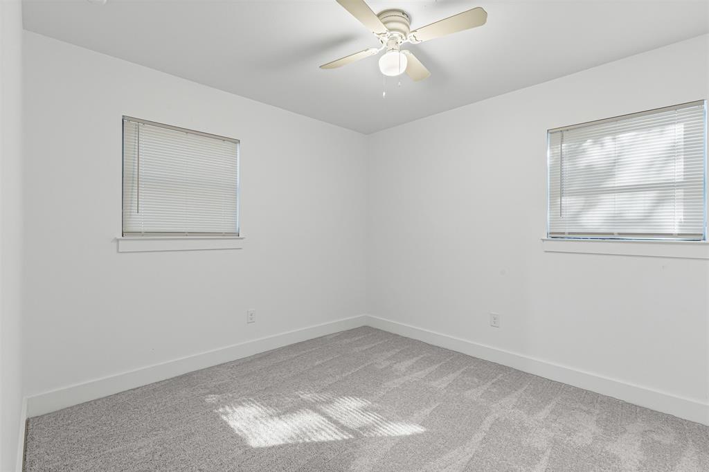 1509 Shirley Way Bedford, TX 76022 - Photo 19 of 26 Empty room with carpet and ceiling fan