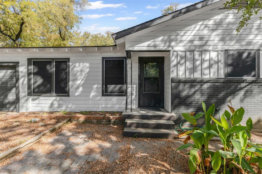 1509 Shirley Way Bedford, TX 76022 - Photo 2 of 26 Doorway to property featuring brick siding
