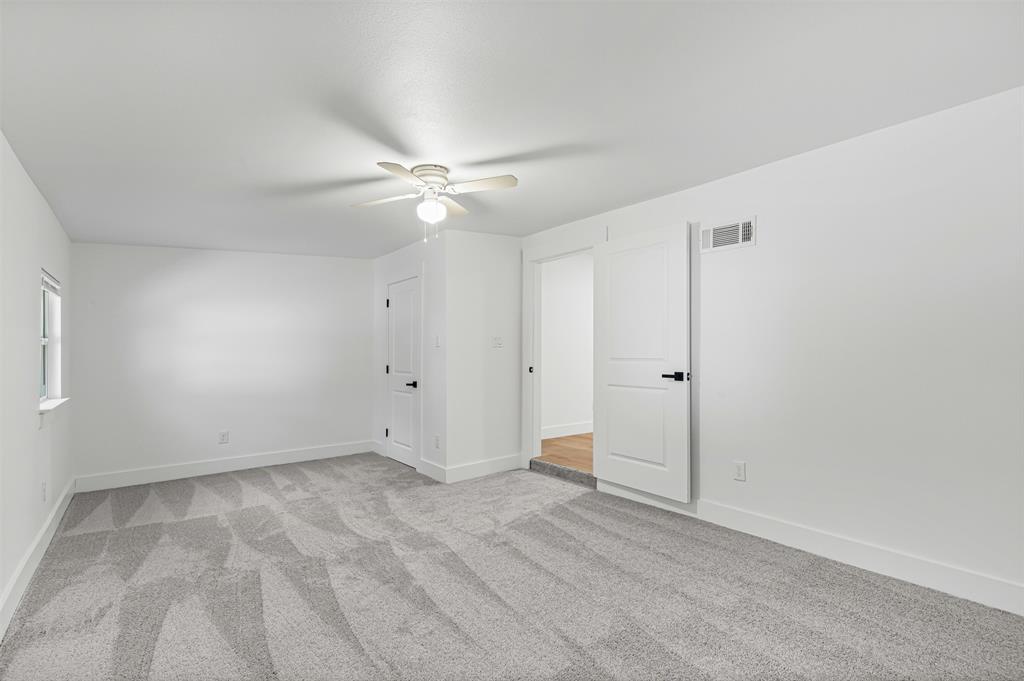 1509 Shirley Way Bedford, TX 76022 - Photo 21 of 26 Empty room with light carpet and ceiling fan
