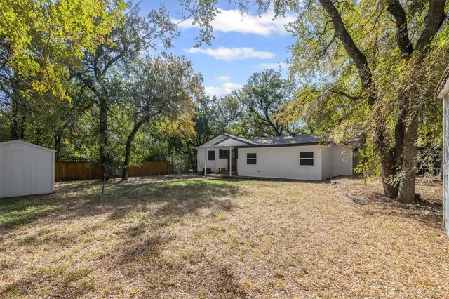 a view of backyard with green space