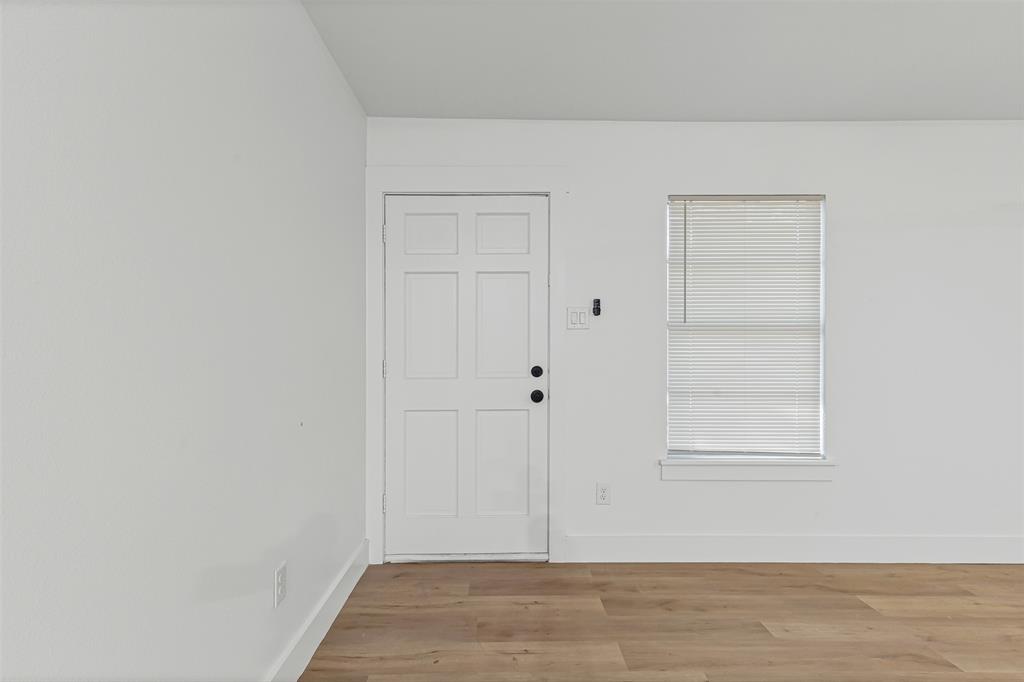1509 Shirley Way Bedford, TX 76022 - Photo 3 of 26 Foyer entrance with baseboards and wood finished floors