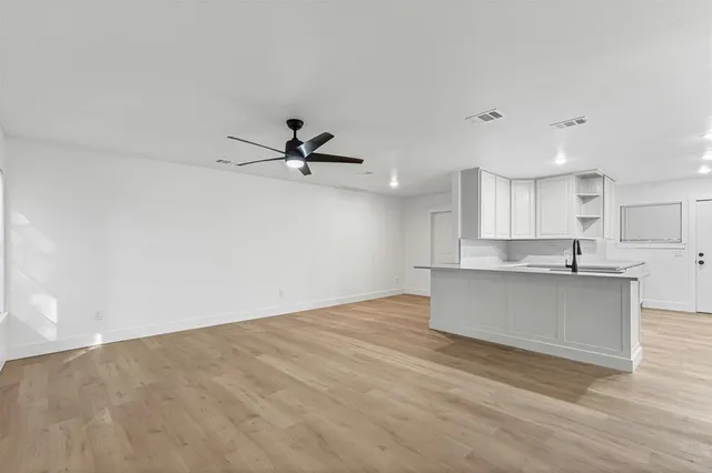 a house that has a tree in front of it