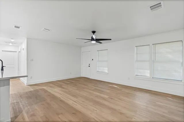 a view of kitchen with wooden floor and window