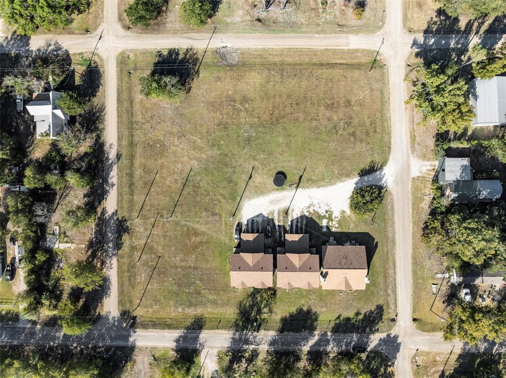 Tbd Shepherd Street Morgan, TX 76671 - Photo 7 of 10 a balcony with a table and chairs and potted plants