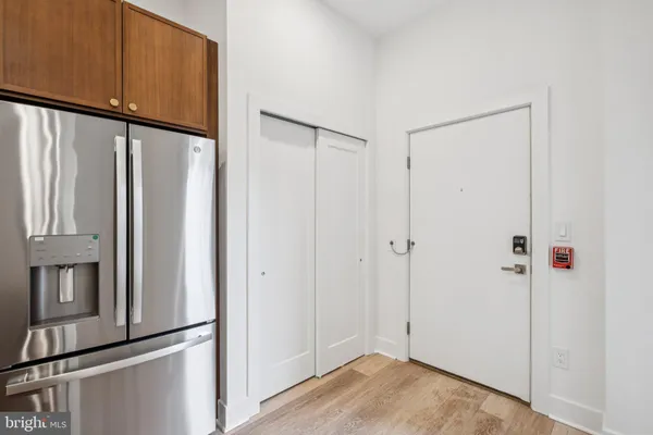 a view of a back door with wooden floor
