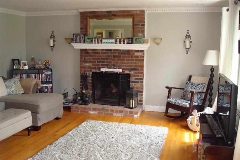 286 Nye Road Centerville, MA 02632 - Photo 3 of 16 a living room with furniture and a fireplace
