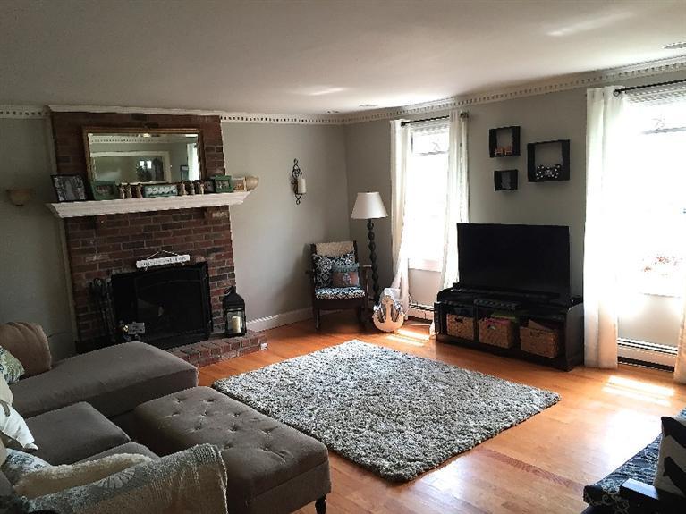 286 Nye Road Centerville, MA 02632 - Photo 4 of 16 a living room with furniture and a fireplace