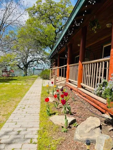 a view of swimming pool with sitting area