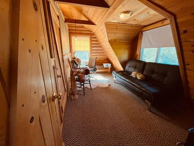 a view of living room with furniture and a window