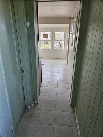 a view of hallway with windows