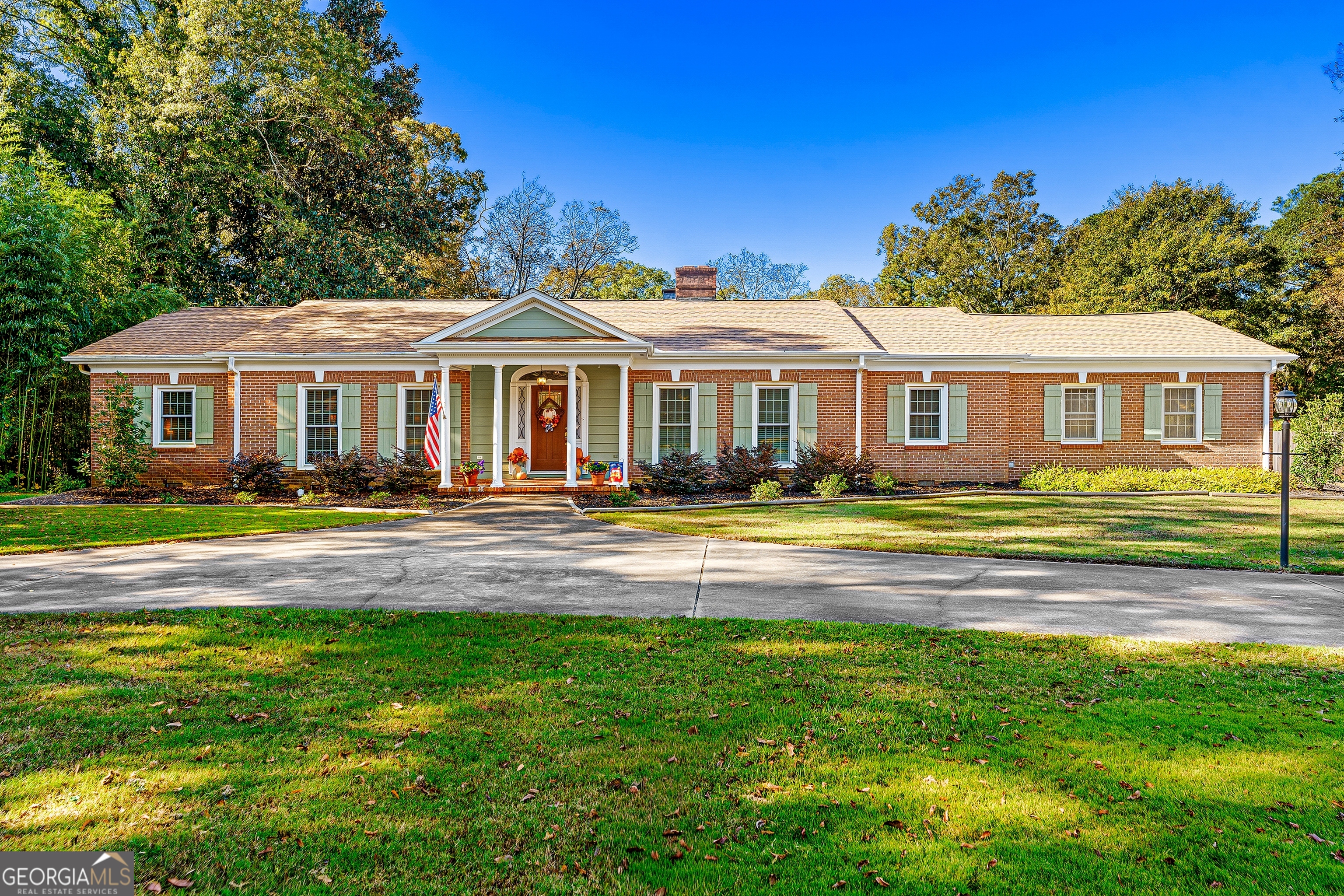 470 Benson Street Hartwell, GA 30643 - Photo 1 of 58 a front view of a house with a garden and swimming pool