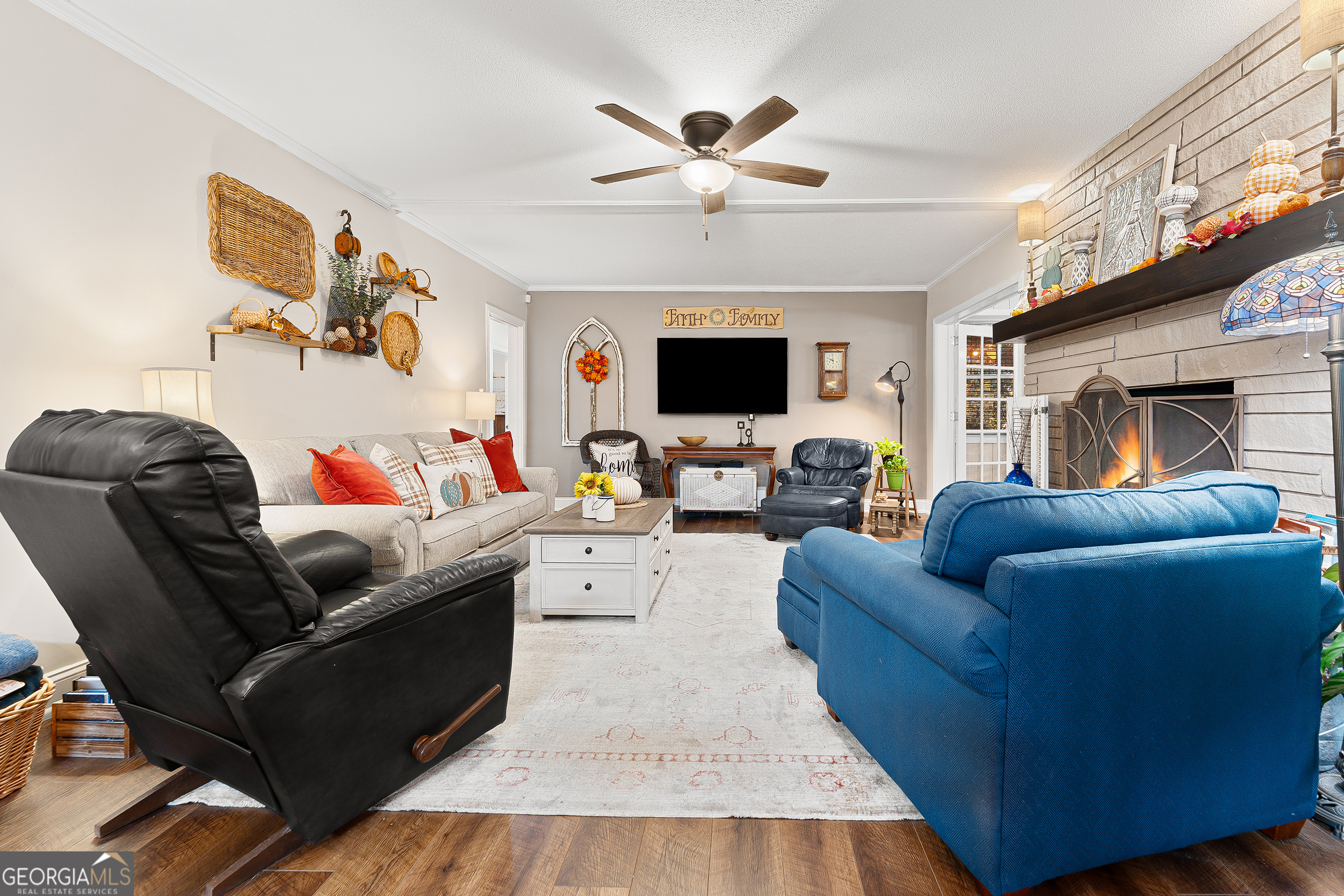 470 Benson Street Hartwell, GA 30643 - Photo 11 of 58 a living room with furniture a fireplace and a flat screen tv