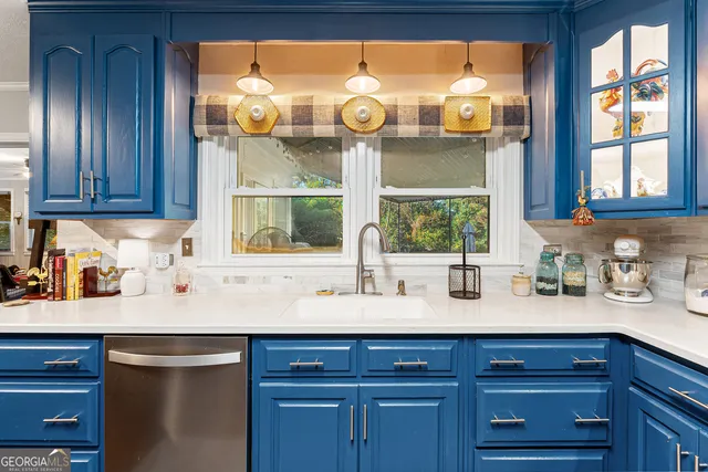 a kitchen with stainless steel appliances wooden floors and wooden cabinets