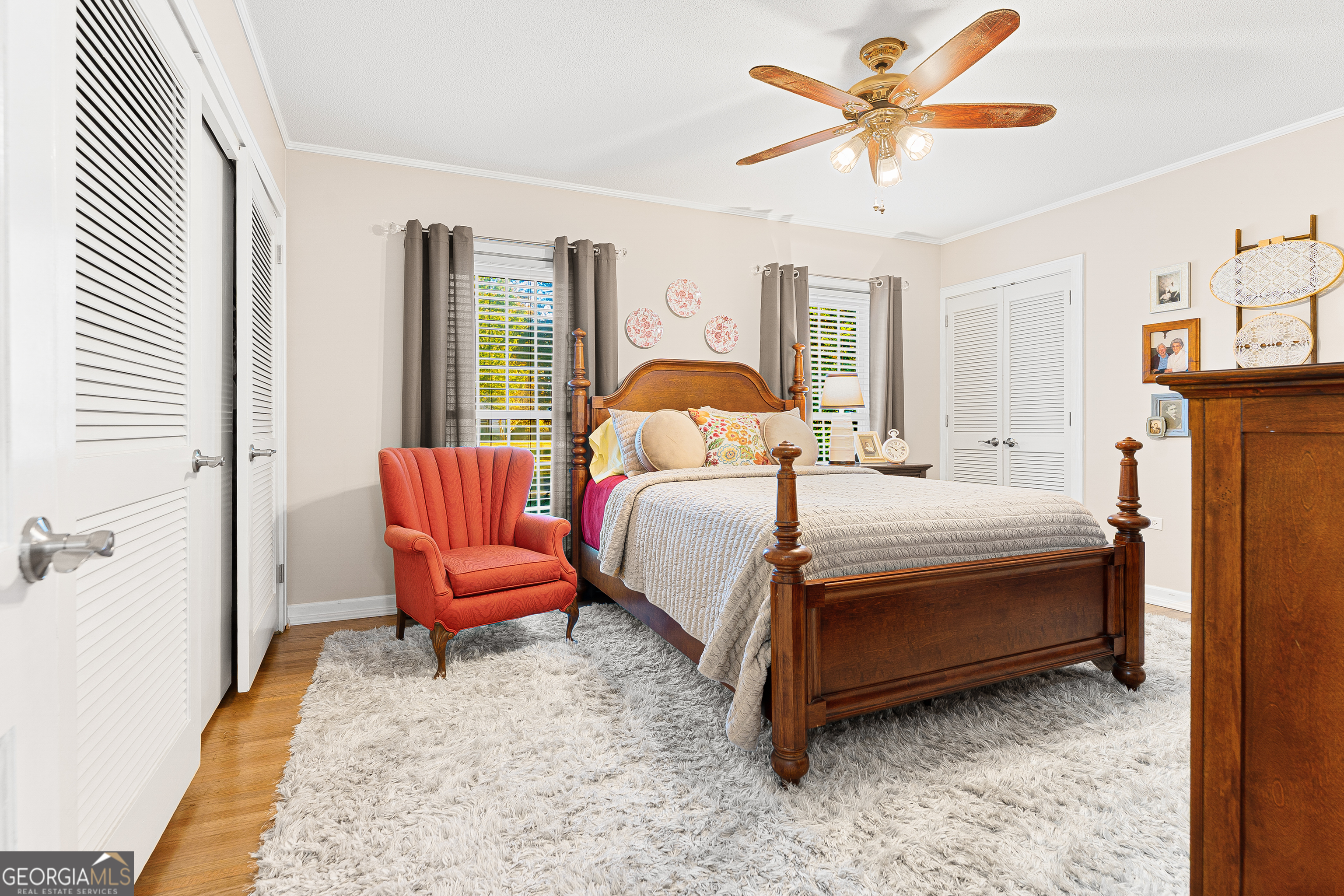 470 Benson Street Hartwell, GA 30643 - Photo 19 of 58 a bedroom with a bed a chandelier and a window