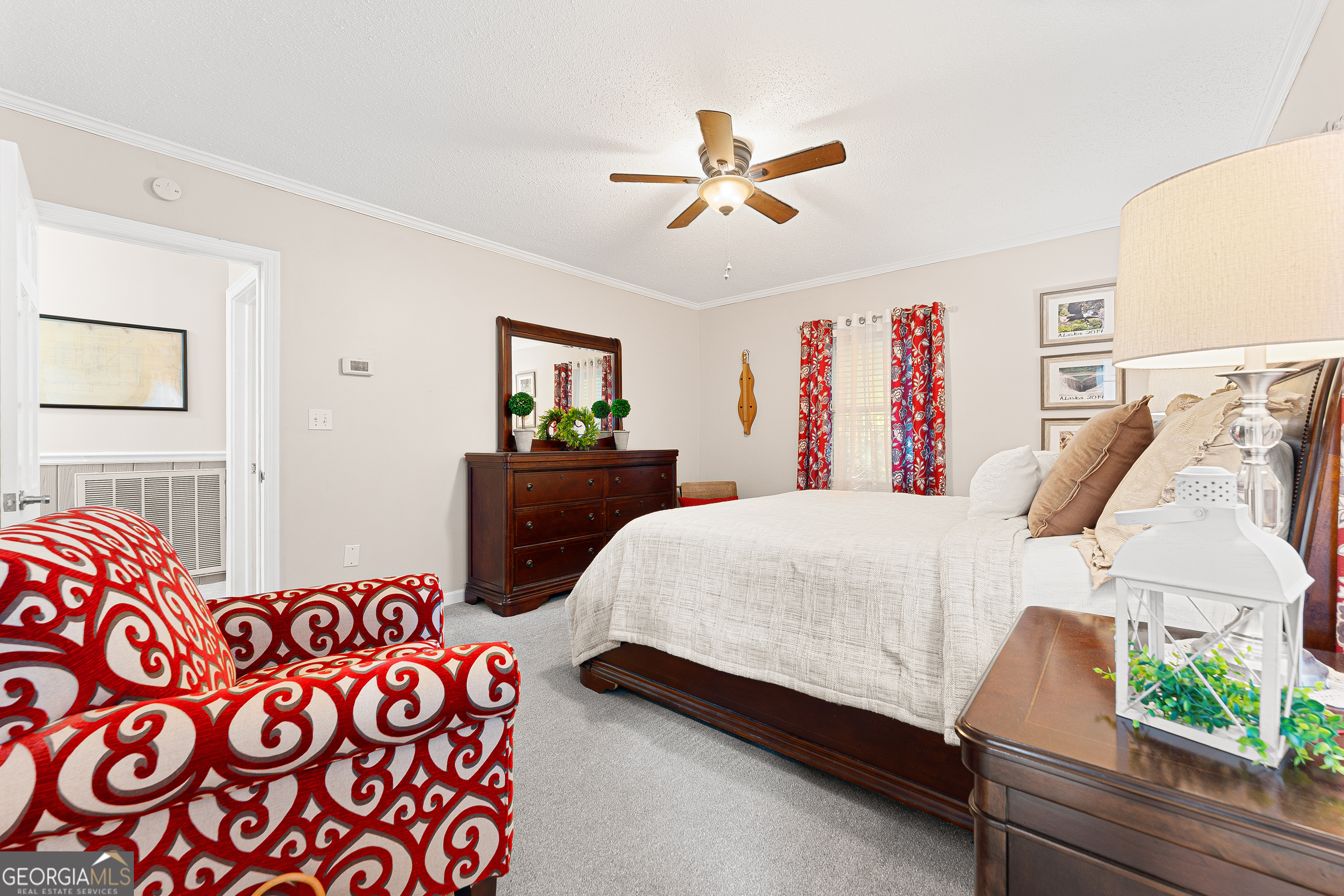 470 Benson Street Hartwell, GA 30643 - Photo 26 of 58 a bedroom with a bed and a chandelier