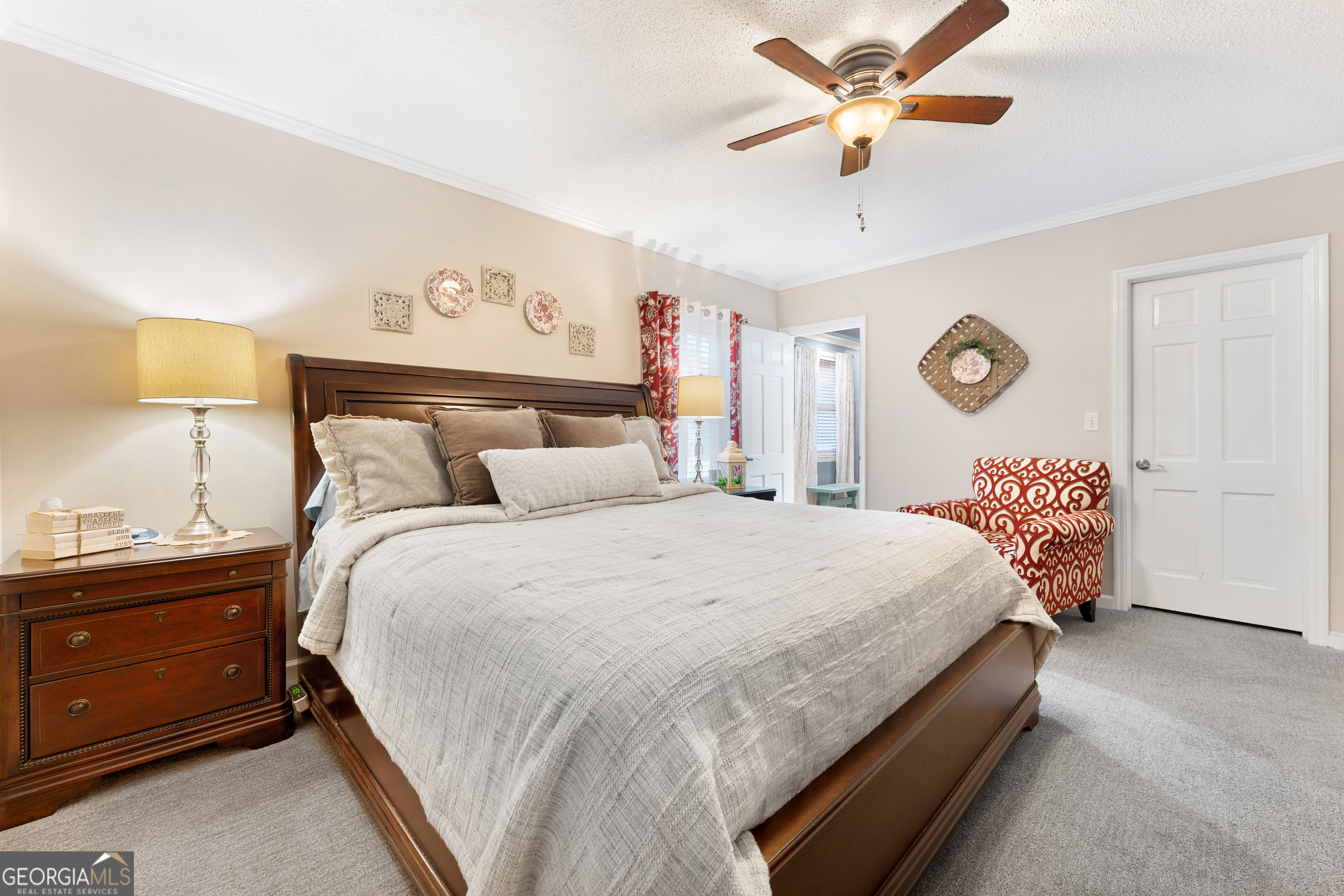 470 Benson Street Hartwell, GA 30643 - Photo 27 of 58 a bedroom with bed and a chandelier