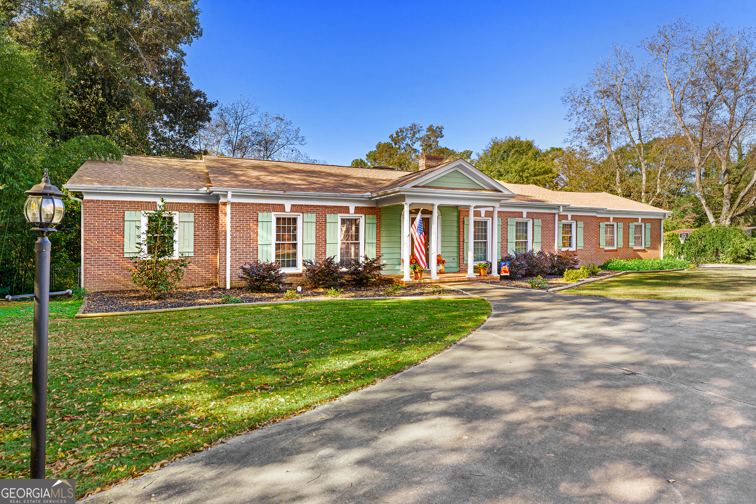 470 Benson Street Hartwell, GA 30643 - Photo 3 of 58 a front view of a house with a yard table and chairs