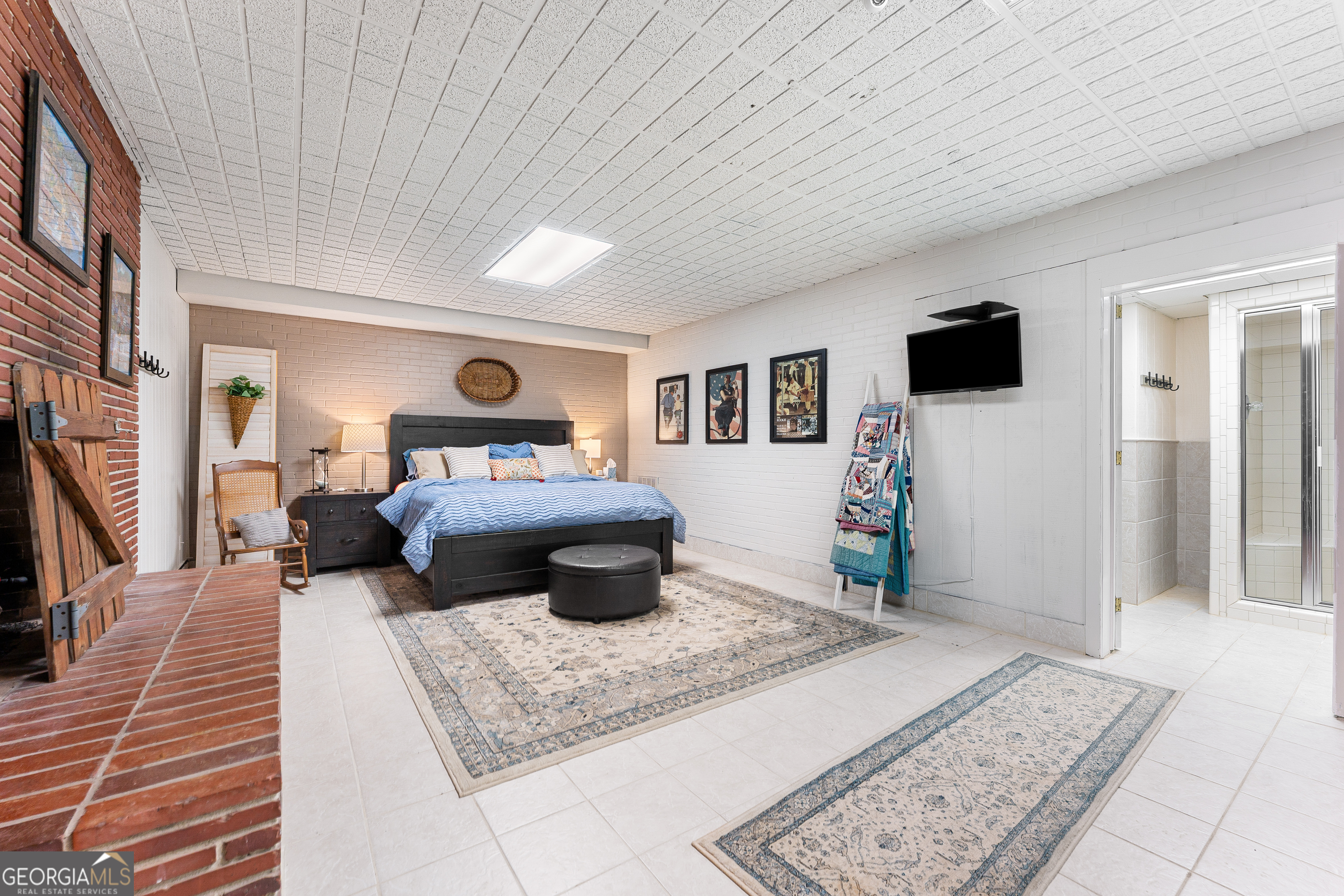 470 Benson Street Hartwell, GA 30643 - Photo 36 of 58 a bedroom with a large bed a flat tv screen and a dresser