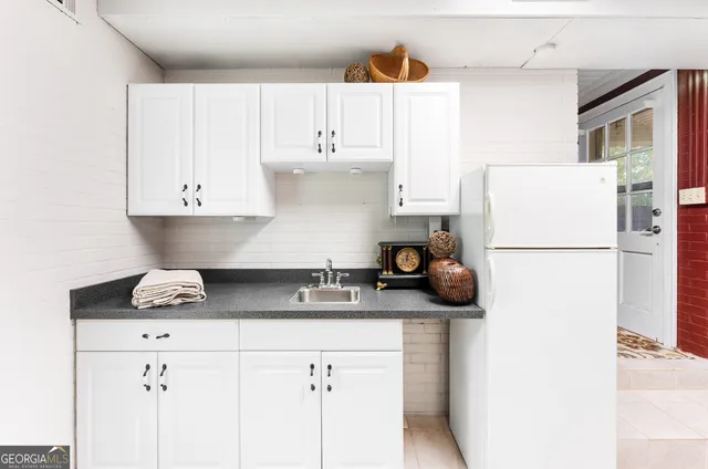a kitchen with stainless steel appliances granite countertop a sink and cabinets