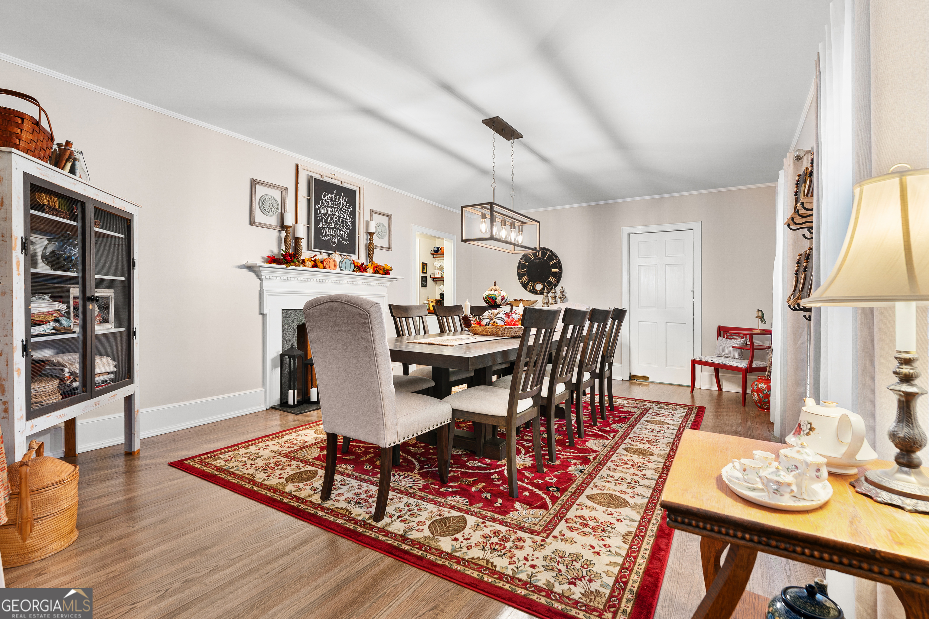 470 Benson Street Hartwell, GA 30643 - Photo 7 of 58 a living room with furniture a rug and a bookshelf