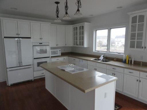 39W341 Preston Circle Geneva, IL 60134 - Photo 4 of 16 a kitchen with stainless steel appliances granite countertop a sink a refrigerator and a granite counter tops with a window