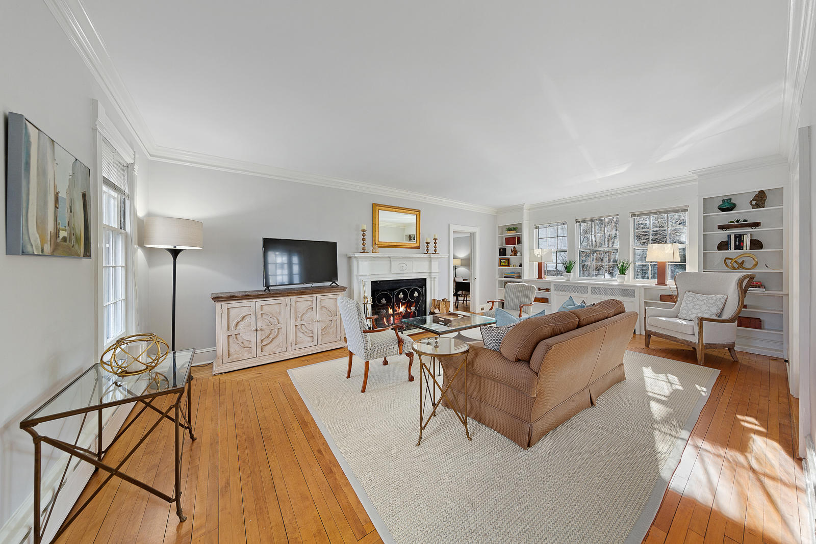 8 Rings End Road Darien, CT 06820 - Photo 14 of 42 a living room with furniture a flat screen tv and a fireplace