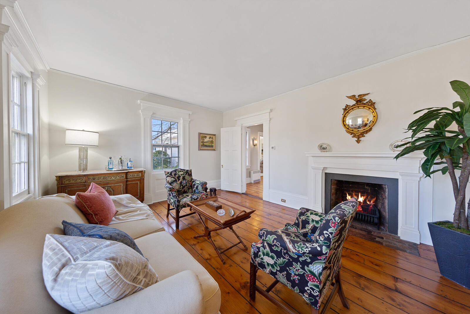 8 Rings End Road Darien, CT 06820 - Photo 5 of 42 a living room with furniture a fireplace and a potted plant