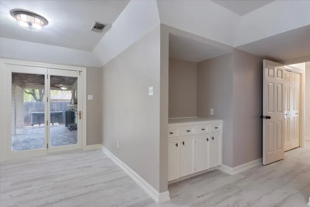 an empty room with mirror