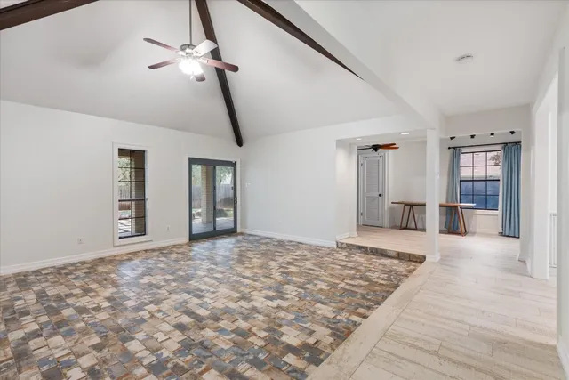 a big room with windows and closet