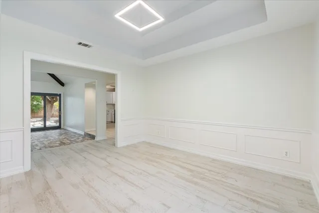 a view of an empty room and window