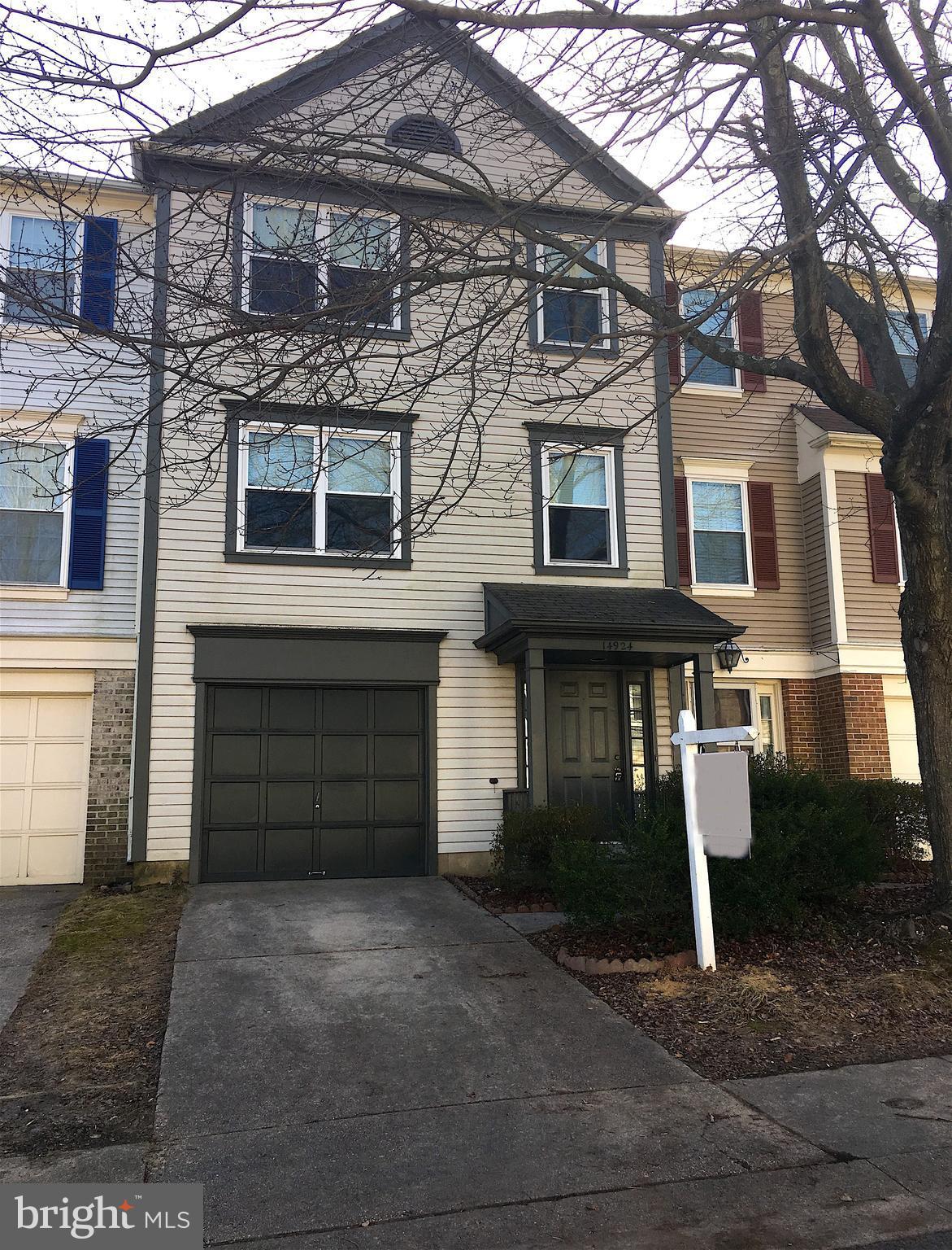 14924 Habersham Circle Silver Spring, MD 20906 - Photo 1 of 27 a front view of a house with a yard