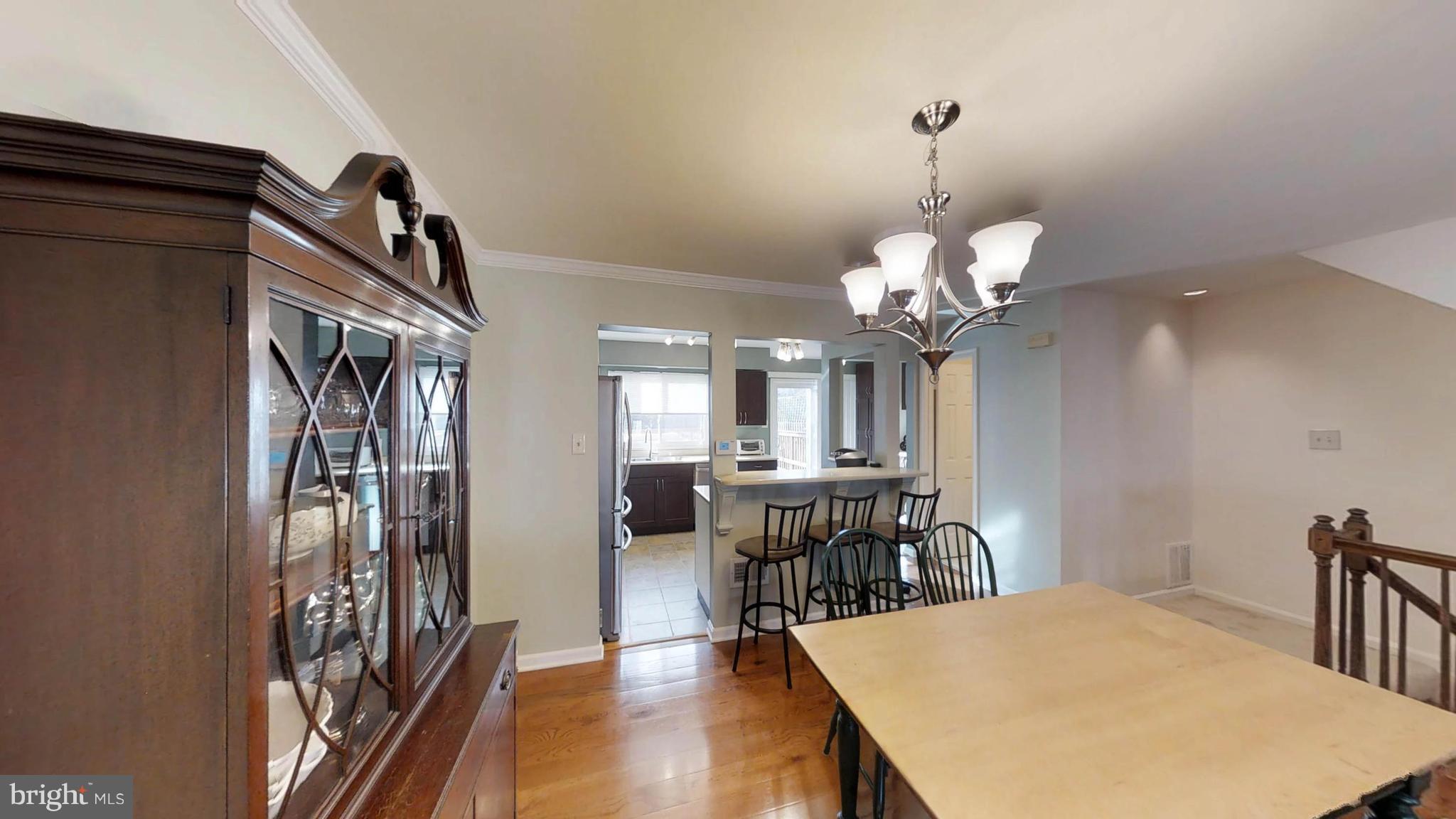 14924 Habersham Circle Silver Spring, MD 20906 - Photo 12 of 27 a view of a dining room with furniture and wooden floor