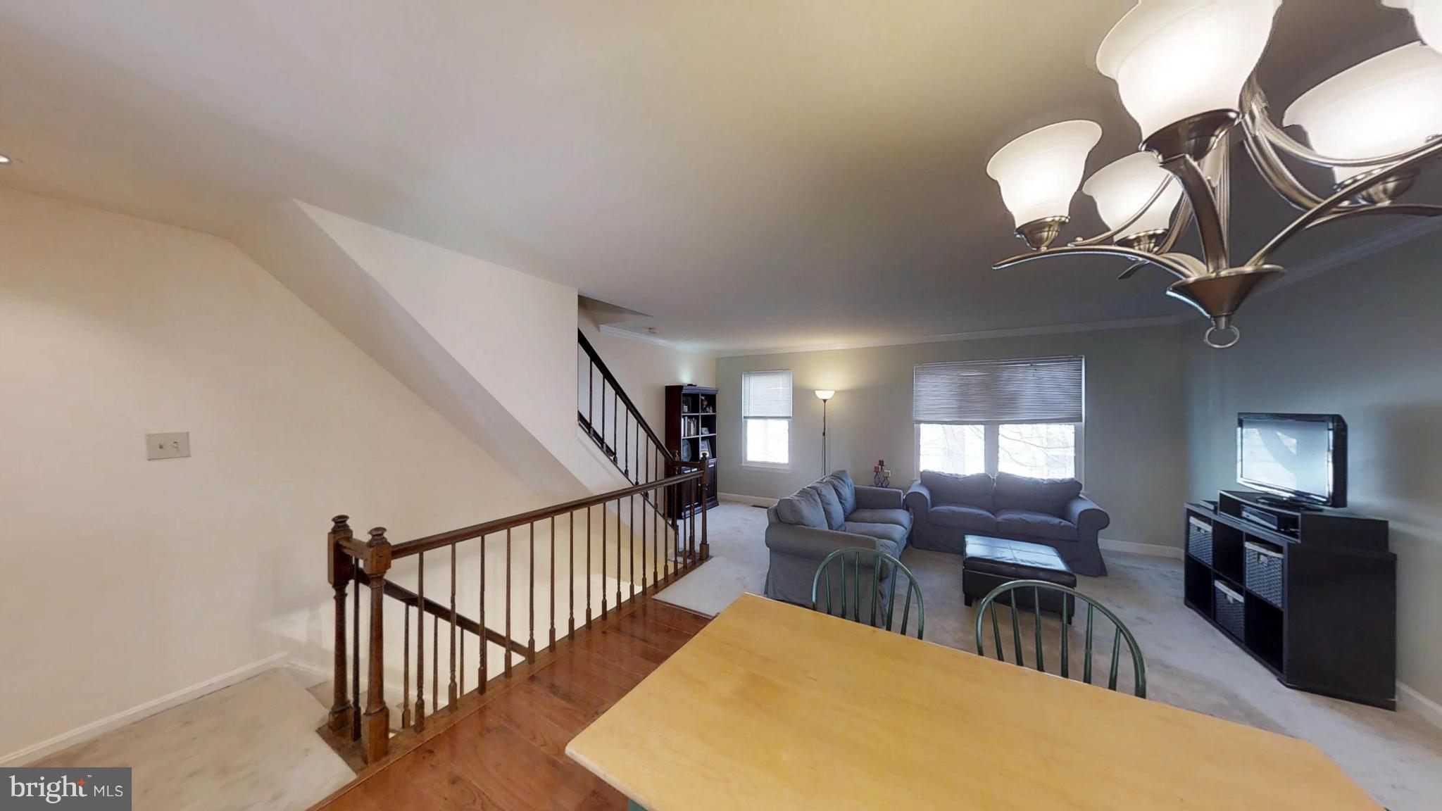 14924 Habersham Circle Silver Spring, MD 20906 - Photo 13 of 27 a view of a livingroom with furniture and a chandelier