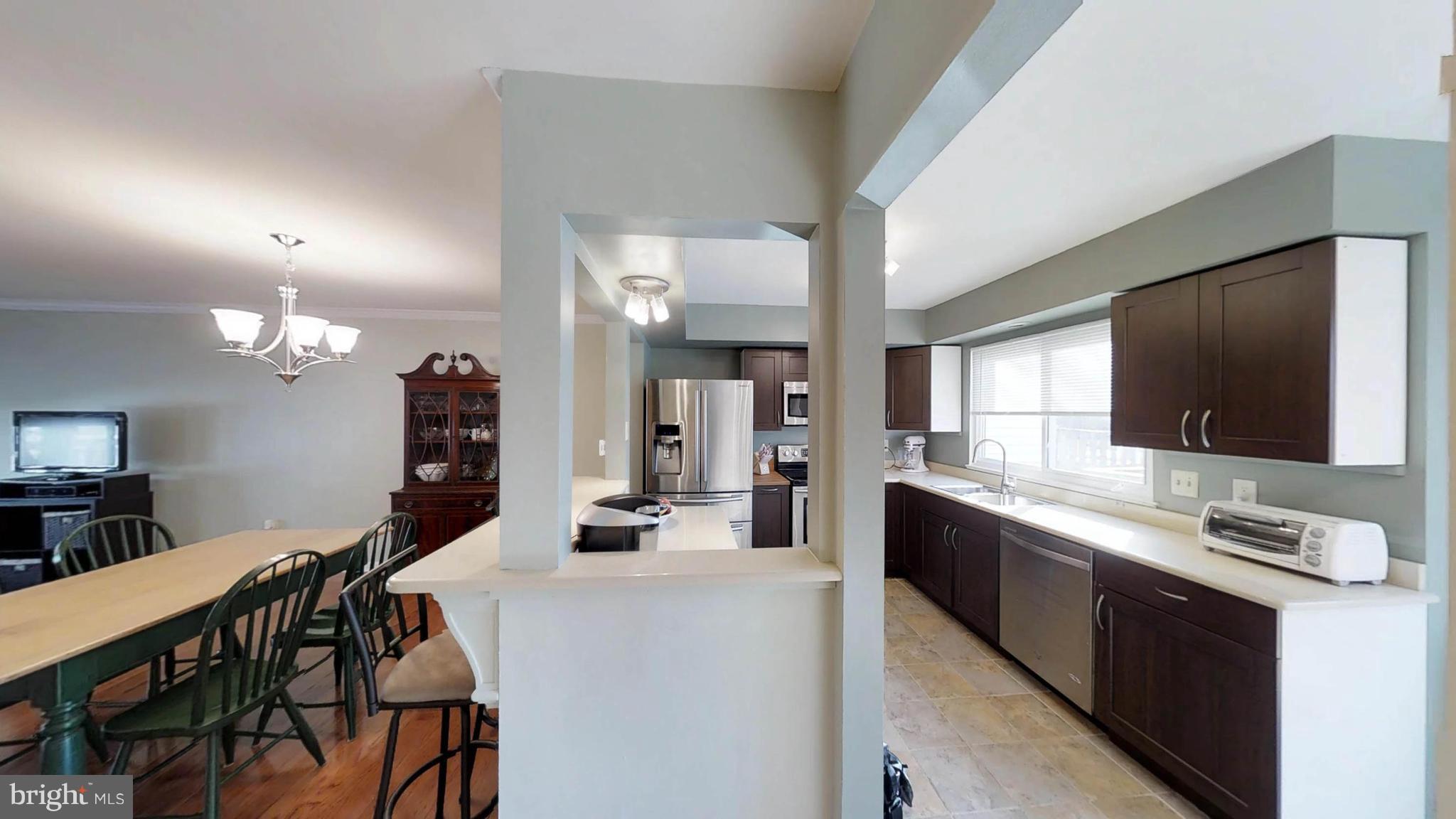 14924 Habersham Circle Silver Spring, MD 20906 - Photo 14 of 27 a large kitchen with a table and chairs